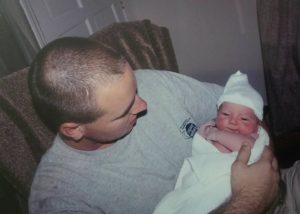 father holding his newborn