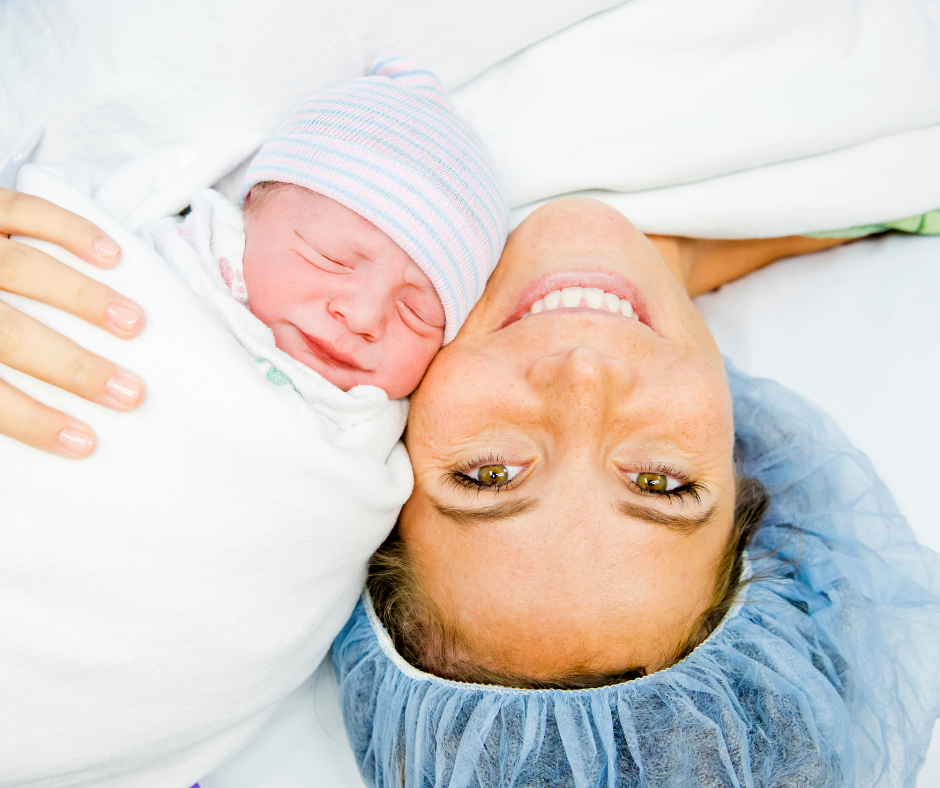Planning for a Cesarean Birth Jacksonville Florida, Smiling mom holding baby after cesarean birth, Jax Florida Cesarean with The Jax Baby Company